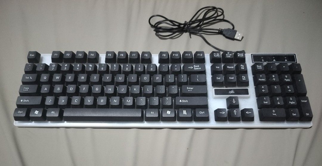 Zeus K001 Gaming keyboard with mechanical lights (Category: Computer Keyboard) located in Manila. Submitted by adydely (Listing ID 1348815831, Image 1). Description: Read this first before asking any questions - no warranty, no return/refund - rarely used keyboard, stocked for a while. expect some dust but all functions are functioning properly. - with issue, check the picture above. small dent on the wire. expect dust since this has been in a ca