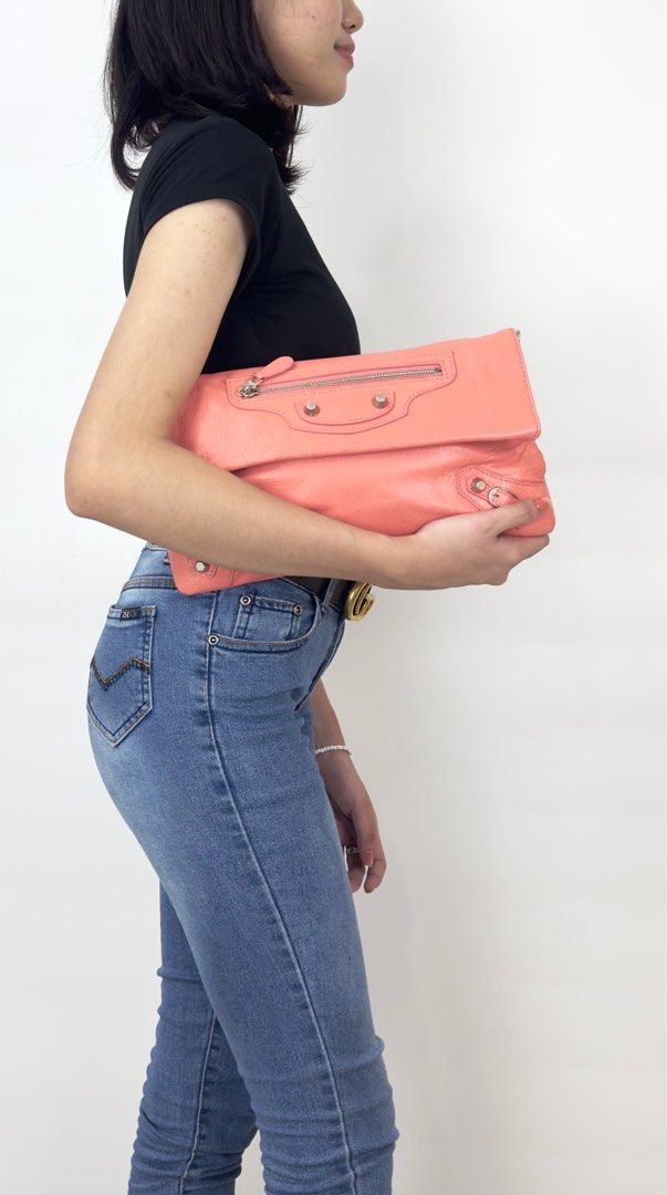 Balenciaga Envelope Clutch Crossbody (Category: Luxury Bags & Wallets) located in Manila. Submitted by luxuryprelovedbagsby_by_agnes (Listing ID 1348975965, Image 3). Description: Balenciaga Rose Azalee Lambskin Leather Giant 12 Envelope Clutch Crossbody W/ Strap Bag The strap can be worn across the chest, hidden with its swivel bases, or removed entirely. It even comes with a matching mirror for on the spot touch ups! Measurements: 12.5” L x 1” 