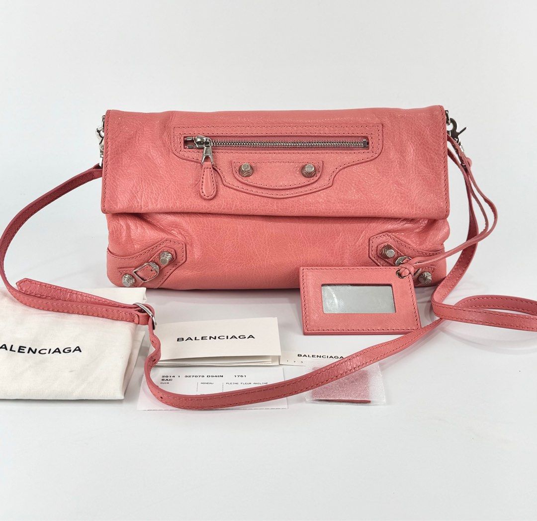 Balenciaga Envelope Clutch Crossbody (Category: Luxury Bags & Wallets) located in Manila. Submitted by luxuryprelovedbagsby_by_agnes (Listing ID 1348975965, Image 1). Description: Balenciaga Rose Azalee Lambskin Leather Giant 12 Envelope Clutch Crossbody W/ Strap Bag The strap can be worn across the chest, hidden with its swivel bases, or removed entirely. It even comes with a matching mirror for on the spot touch ups! Measurements: 12.5” L x 1” 