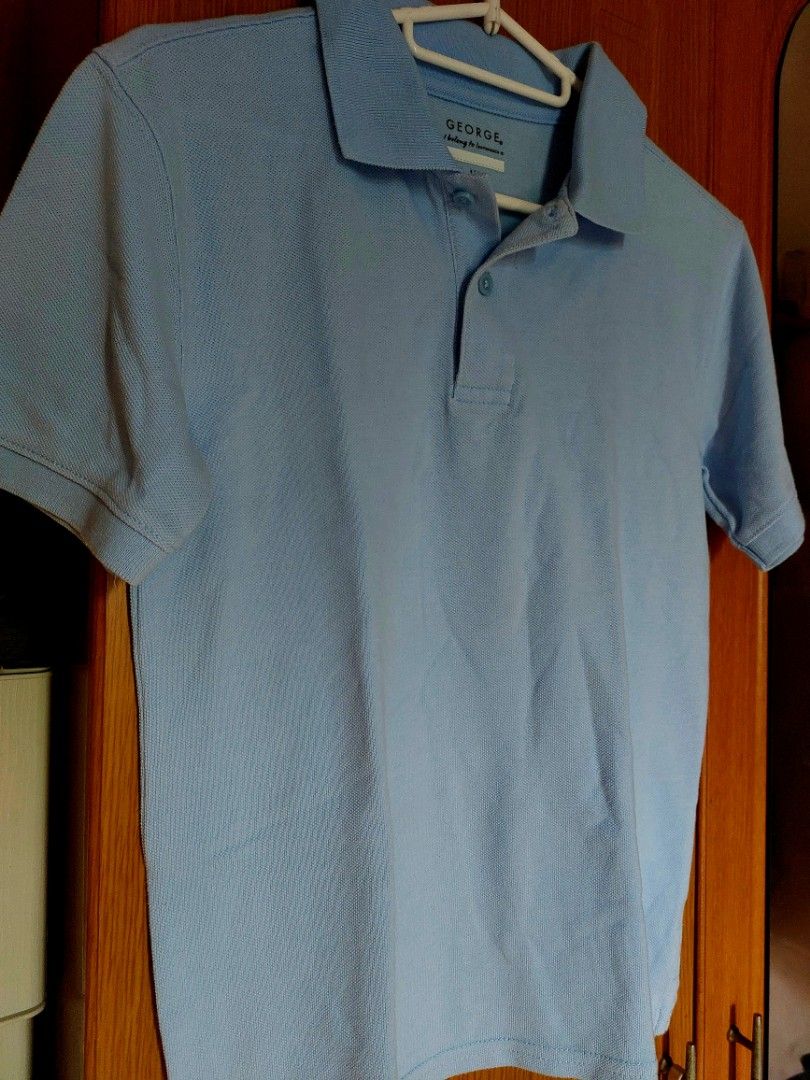 GEORGE Kids Polo Shirt Large (Category: Babies & Kids Fashion) located in Pasig City. Submitted by ielsc (Listing ID 1348896796, Image 1). Description: Brand: George Color: Light/Sky Blue Size: Large (10-12) Condition: Lightly Used.