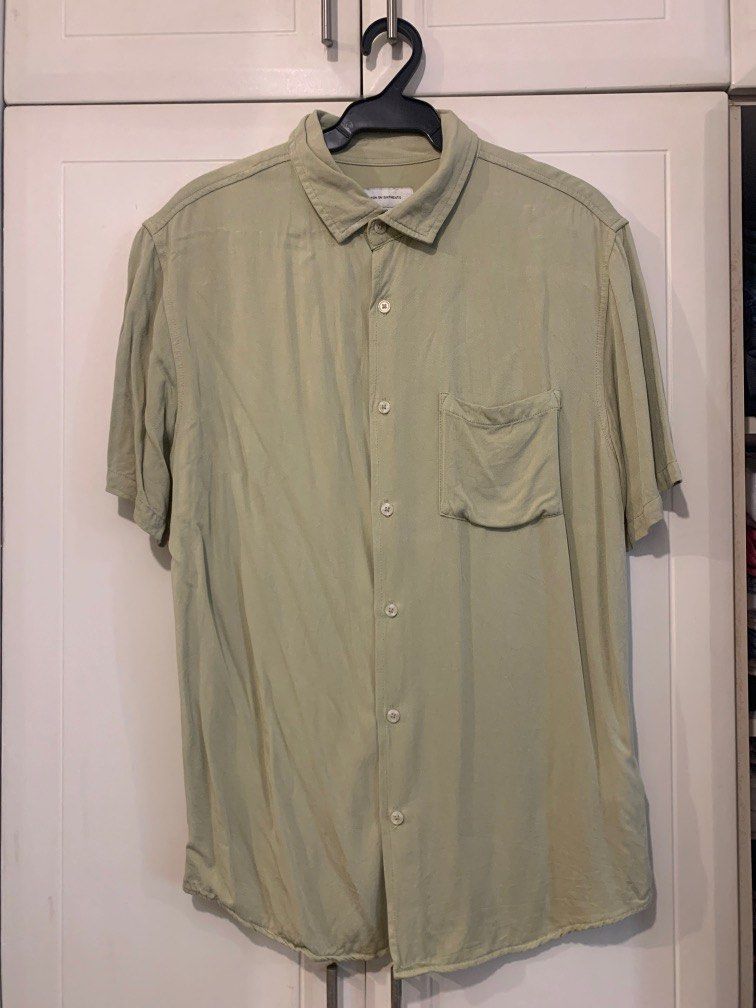 Green Button Down Short Sleeve Shirt (Category: Tshirts & Polo Shirts ) located in Makati City. Submitted by mikodeej (Listing ID 1348906452, Image 1). Description: Green button down shirt Chest: 46cm Shoulders: 50cm Length: 75cm.