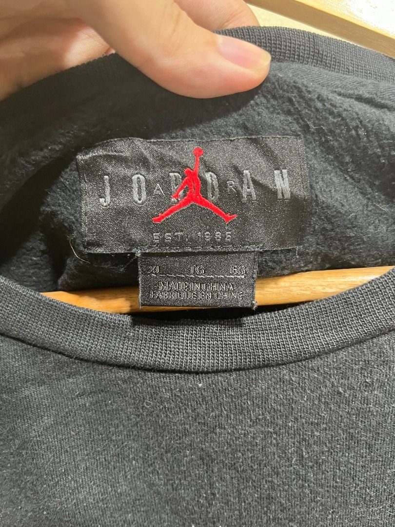 JORDAN 'Air Jordan 23' Sweater (Category: Tshirts & Polo Shirts ) located in Mandaluyong City. Submitted by lcfl1014 (Listing ID 1348931961, Image 3). Description: JORDAN 'Air Jordan 23' Sweater - may faux leather sa shoulder Tela: Heavy Cotton Size: XL on tag. 25inches width, 27inches length Color: Black. 9.5/10 Condition: 9.5/10. lukot lang print, no issues Location: Mandaluyong Delivery: Sho.p.e, Lalamove, J&T.