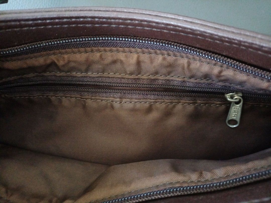 Ladies Bag (Category: Purses & Pouches) located in Paranaque City. Submitted by 27rcd (Listing ID 1348863908, Image 3). Description: Decluttering personal used Brown Color 8"h x 13"L Issue: molds from the storage. needs cleaning..