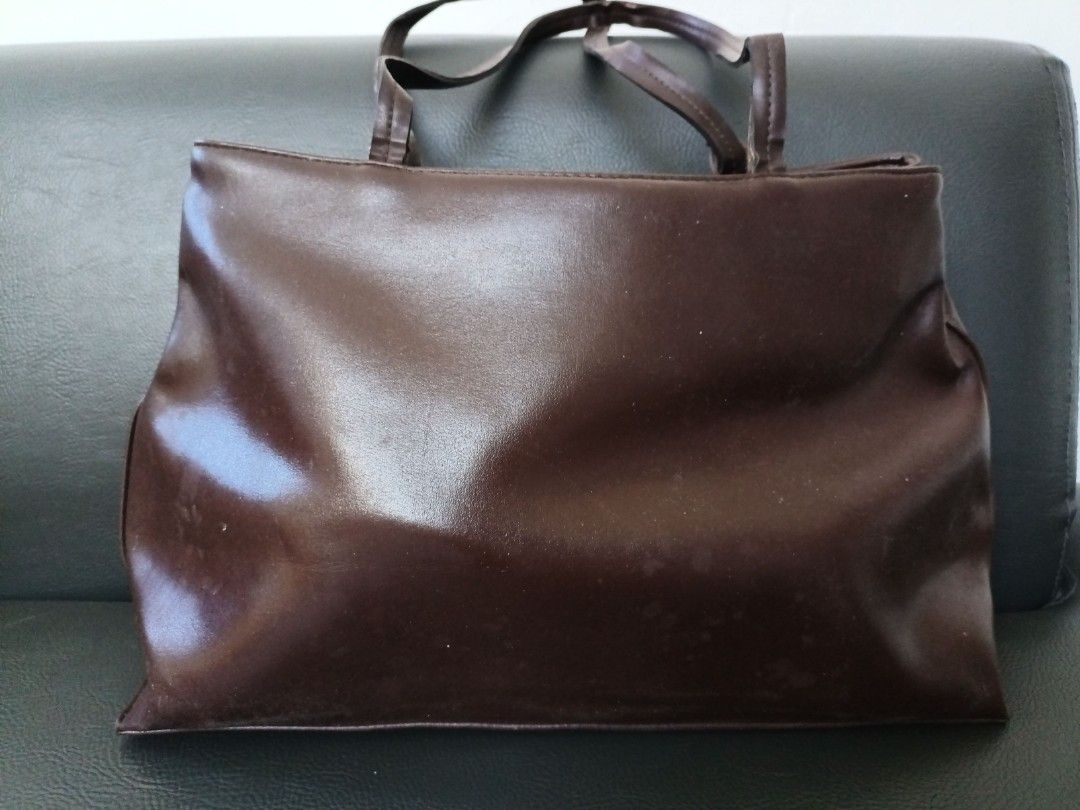 Ladies Bag (Category: Purses & Pouches) located in Paranaque City. Submitted by 27rcd (Listing ID 1348863908, Image 2). Description: Decluttering personal used Brown Color 8"h x 13"L Issue: molds from the storage. needs cleaning..