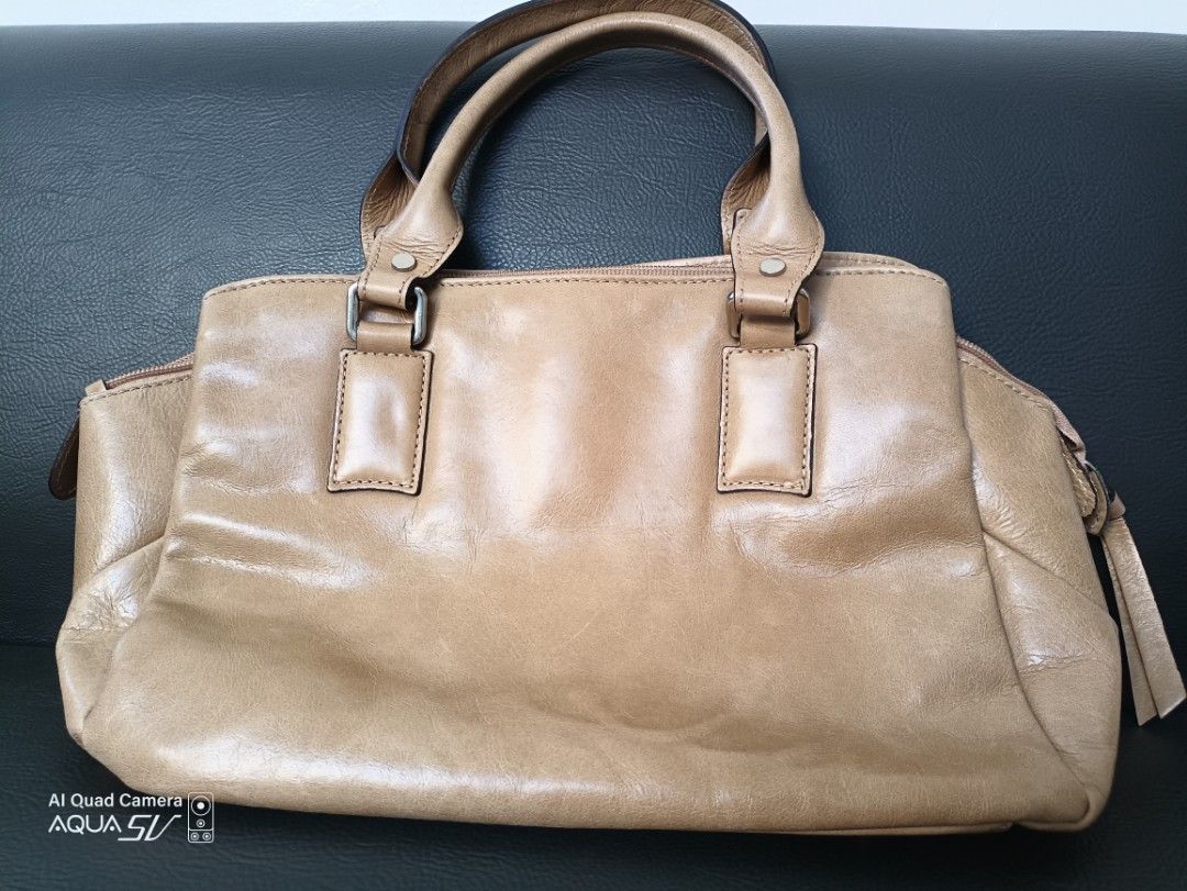 Ladies Handbag (Category: Luxury Bags & Wallets) located in Paranaque City. Submitted by 27rcd (Listing ID 1348838307, Image 1). Description: Decluttering personal used handbag. Made in Italy Beige color 8"h x 12"L condition 9.