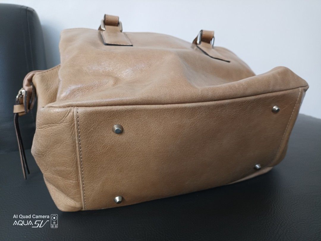 Ladies Handbag (Category: Luxury Bags & Wallets) located in Paranaque City. Submitted by 27rcd (Listing ID 1348838307, Image 2). Description: Decluttering personal used handbag. Made in Italy Beige color 8"h x 12"L condition 9.