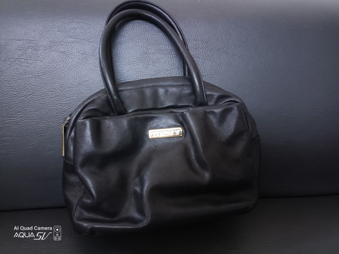 Ladies Mini Bag (Category: Purses & Pouches) located in Paranaque City. Submitted by 27rcd (Listing ID 1348843584, Image 1). Description: Decluttering personal used bag 6" h x 9"L Black color DKNY.