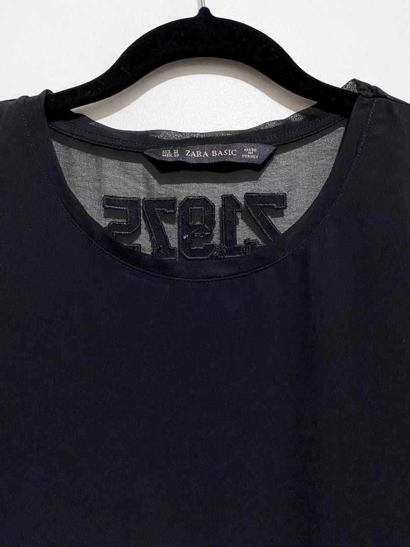 Zara Basic Chiffon Z1975 See Through Back Black T-shirt Top (Category: Shirts) located in Manila. Submitted by simoonie (Listing ID 1348854611, Image 3). Description: In great condition! 👍 Only worn once or twice. Store bought. Zara black chiffon tee shirt: Z1975 back satin embroidery, see through sleeves and back, flowy material, side slits, longer back. ✨ — Measurements Approx (lay flat) — - Size on tag: US Medium - Chest (armpit to armpit): 2