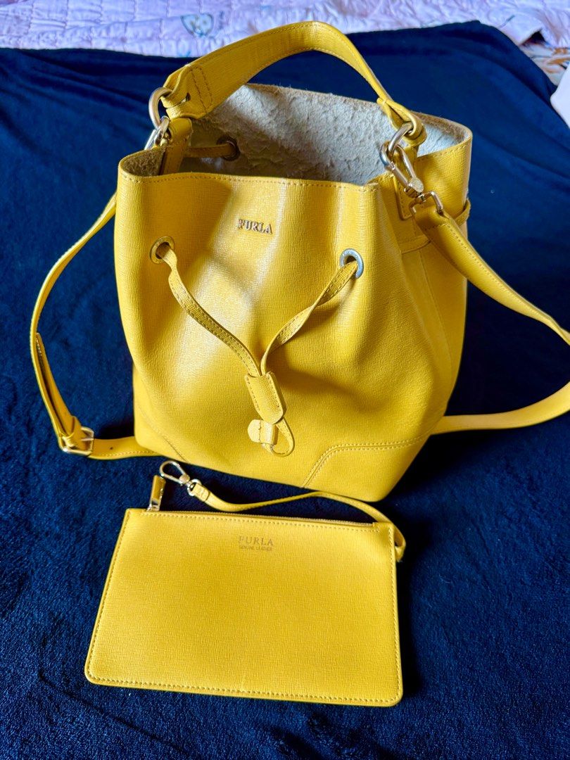 Furla Stacy - Authentic Luxury Bucket Bag (Category: Luxury Bags & Wallets) located in Bulacan. Submitted by Deadly_Crossover (Listing ID 1349034834, Image 1). Description: Authentic Furla Stacy Type: Bucket Bag Inclusion: small wallet and shoulder strap Size: Medium Asking Price: P2,300 only Flaws: inside leather, sakit ng Furla bags, see pics. Pero pwede ma-iscrape or cut the strands naman. Bought in Singapore RFS: Bawas bags What you see is wh