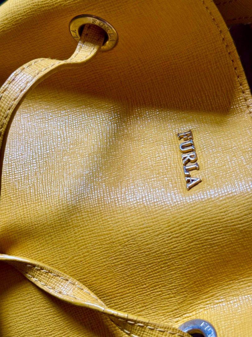Furla Stacy - Authentic Luxury Bucket Bag (Category: Luxury Bags & Wallets) located in Bulacan. Submitted by Deadly_Crossover (Listing ID 1349034834, Image 2). Description: Authentic Furla Stacy Type: Bucket Bag Inclusion: small wallet and shoulder strap Size: Medium Asking Price: P2,300 only Flaws: inside leather, sakit ng Furla bags, see pics. Pero pwede ma-iscrape or cut the strands naman. Bought in Singapore RFS: Bawas bags What you see is wh