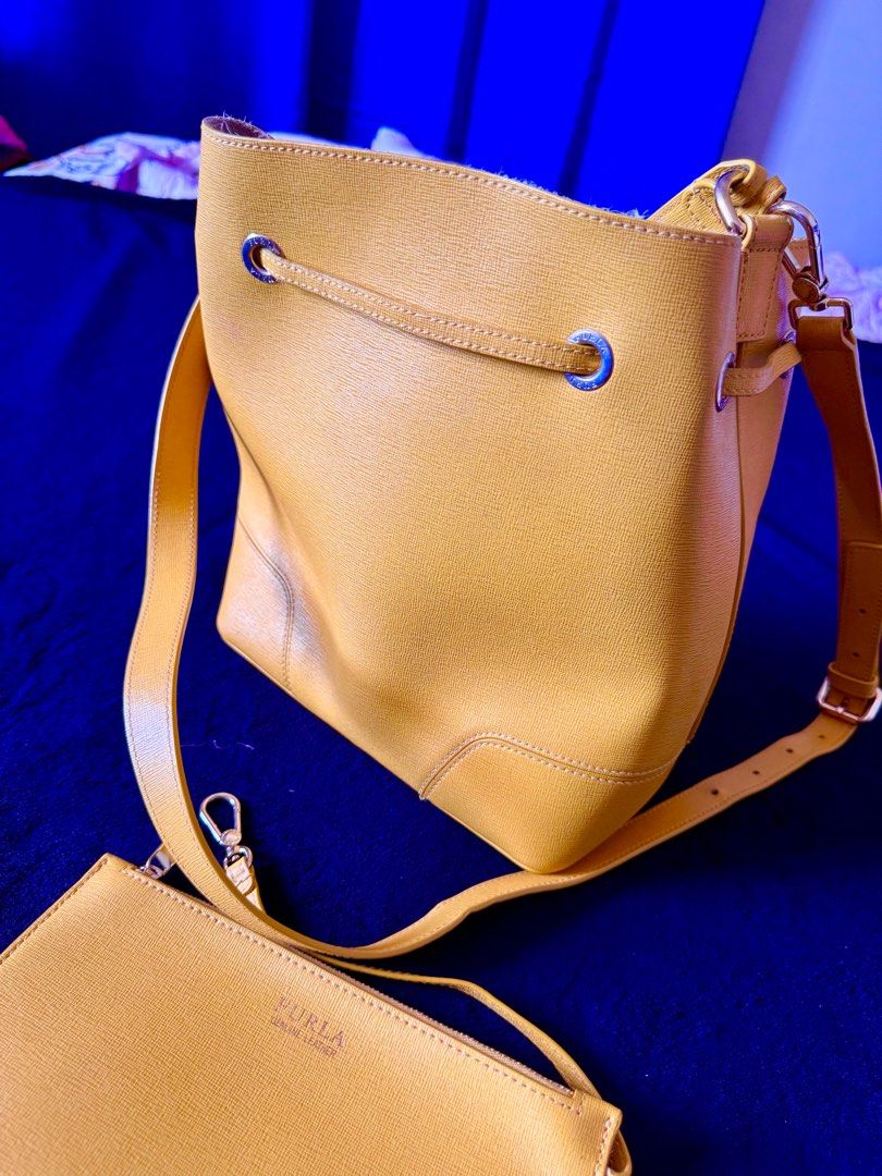 Furla Stacy - Authentic Luxury Bucket Bag (Category: Luxury Bags & Wallets) located in Bulacan. Submitted by Deadly_Crossover (Listing ID 1349034834, Image 3). Description: Authentic Furla Stacy Type: Bucket Bag Inclusion: small wallet and shoulder strap Size: Medium Asking Price: P2,300 only Flaws: inside leather, sakit ng Furla bags, see pics. Pero pwede ma-iscrape or cut the strands naman. Bought in Singapore RFS: Bawas bags What you see is wh