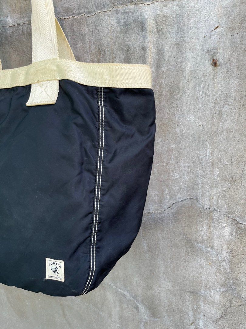 Porter Nylon Tote Bag (Category: Luxury Bags & Wallets) located in Baguio. Submitted by lordeidara (Listing ID 1349095249, Image 3). Description: 8/10 Signs of usage Needs light cleaning Color:Black Material:Polyester/Nylon Size on tag: Length:14.5 Width:6 Height:13 Strap Length:21 Number of Pockets:.