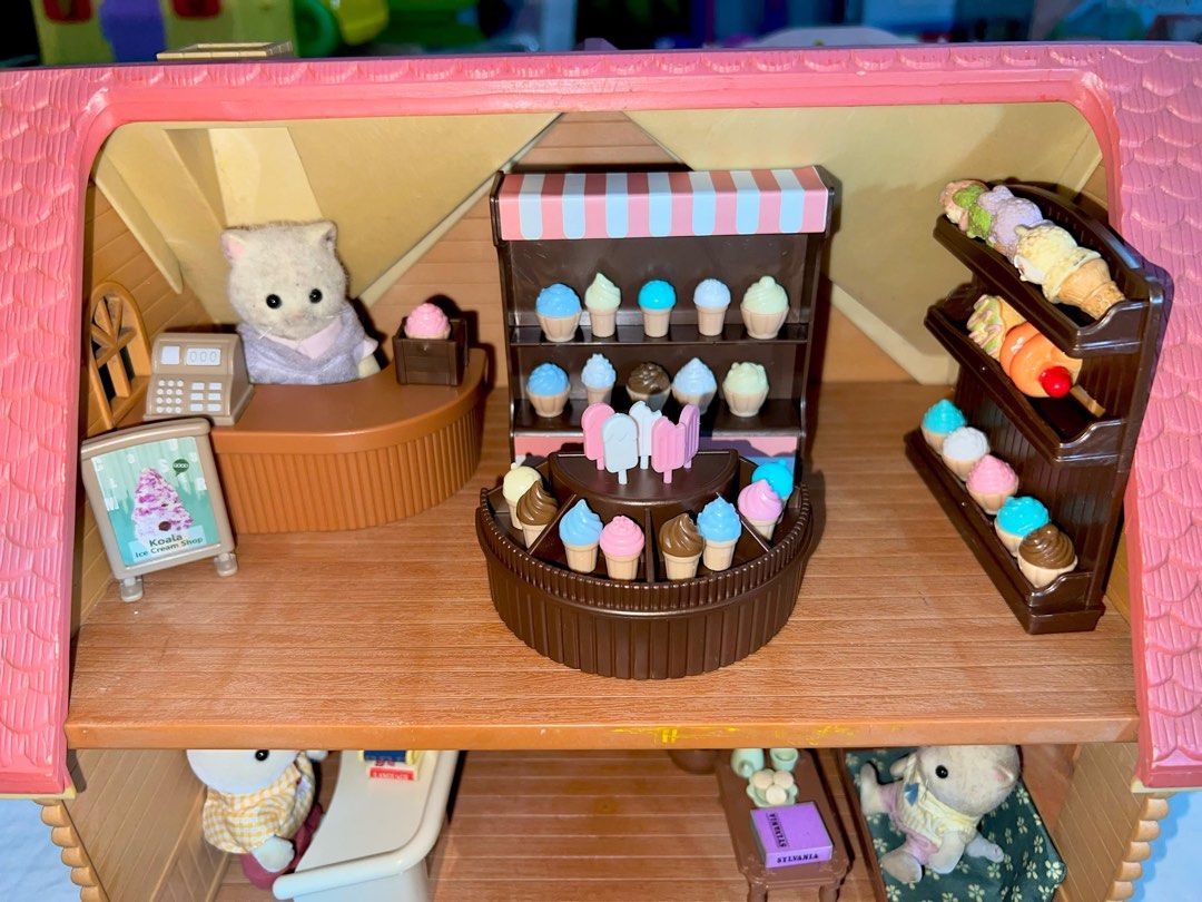 Sylvanian families beech copper beech cottage house (Category: Figurines & Statues) located in San Fernando. Submitted by mgpy08 (Listing ID 1349127647, Image 3). Description: Flower shop and books store All critters are included.