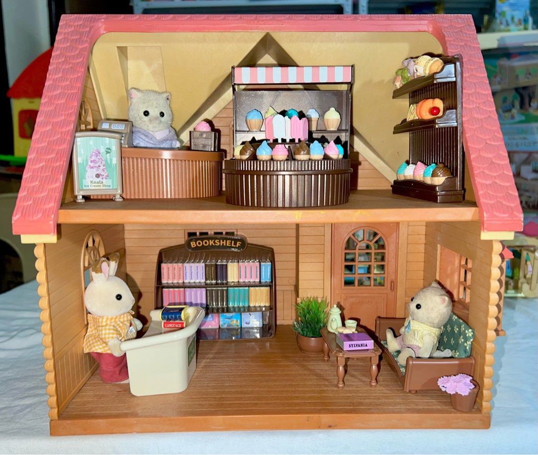 Sylvanian families beech copper beech cottage house (Category: Figurines & Statues) located in San Fernando. Submitted by mgpy08 (Listing ID 1349127647, Image 1). Description: Flower shop and books store All critters are included.