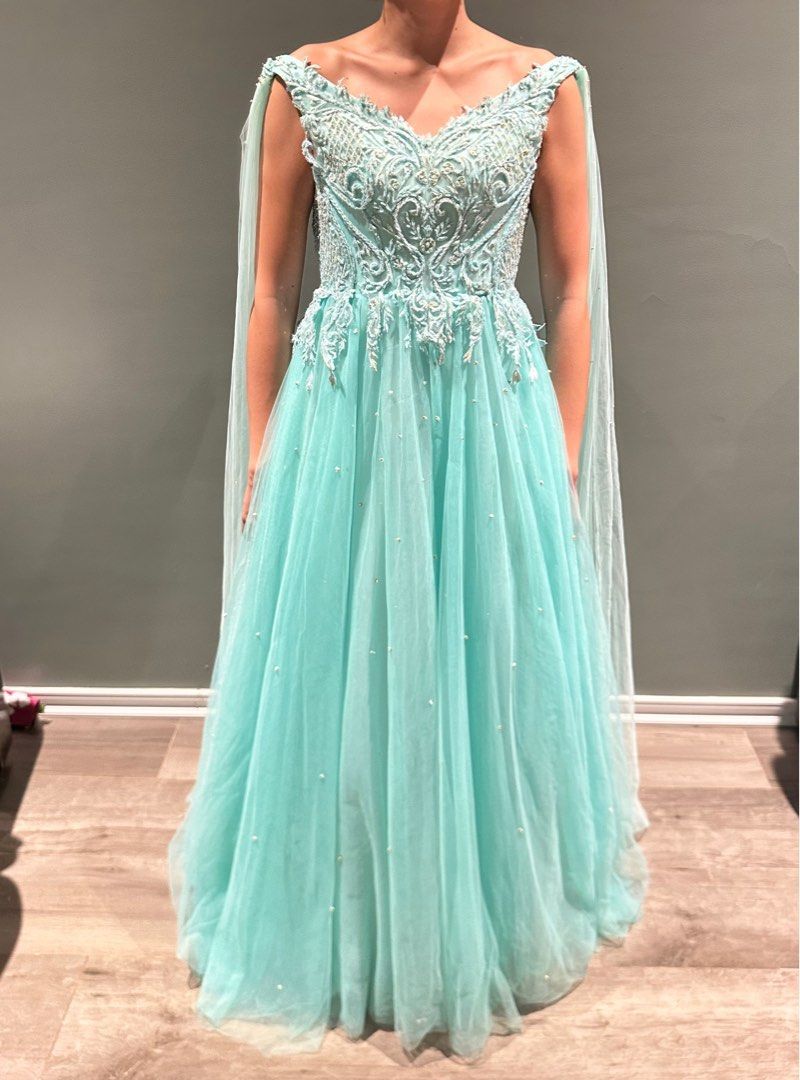 Turquoise tulle beaded gown (Prom) (Category: Evening dresses & gowns) located in Jimenez. Submitted by cflamd (Listing ID 1348547715, Image 1). Description: RFS: decluttering Worn once by sister during prom Fits XXS to XS size Padded Reference photos tight on me (can't close back, but can be altered) Last photo is when worn by sister (right size) Free shipping.