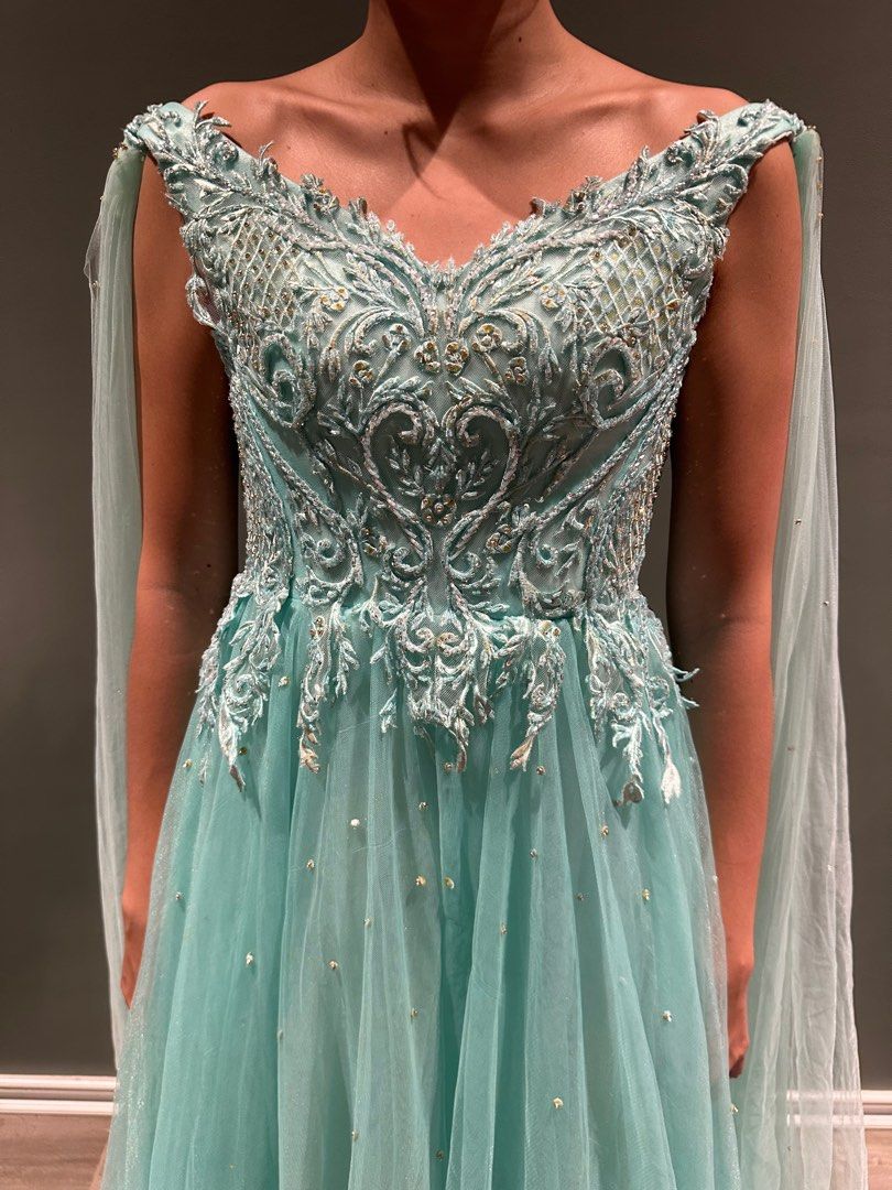 Turquoise tulle beaded gown (Prom) (Category: Evening dresses & gowns) located in Jimenez. Submitted by cflamd (Listing ID 1348547715, Image 2). Description: RFS: decluttering Worn once by sister during prom Fits XXS to XS size Padded Reference photos tight on me (can't close back, but can be altered) Last photo is when worn by sister (right size) Free shipping.