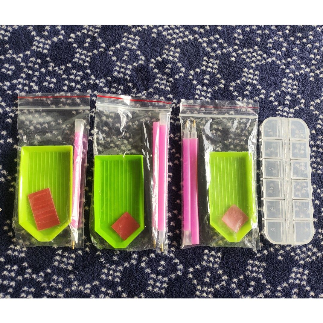 14 pcs Diamond Painting tools set (Category: Craft Supplies & Tools) located in Quezon City. Submitted by all_items_50_each (Listing ID 1349319274, Image 1). Description: 14 pcs Diamond painting tools set 3 sets available - 50/set Set includes: 1 x 12 slots storage 2 x Single pen 3 x Single pen with 3 drills 2 x Tweezers 3 x Wax/red mud 3 x Plate/tray 💲ALL ITEMS 50 each 💰MOP: GCash ➕Add shipping fee ❌NO rush shipping, meet up, haggling ✔️for ru