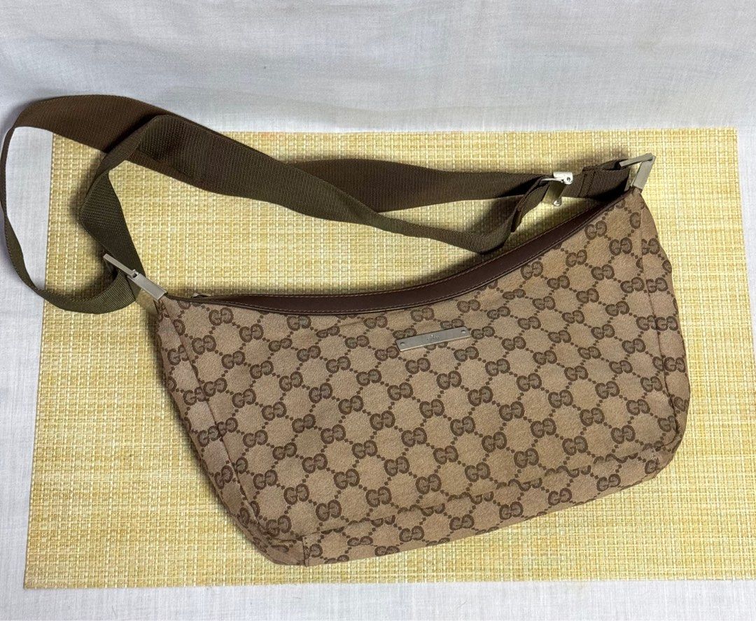 GUCCI Boat Bag Web Monogram Shoulder Bag (Category: Luxury Bags & Wallets) located in Baguio. Submitted by pwz-eshop (Listing ID 1349330404, Image 3). Description: • Please make reading a habit! • I do not reserve items. I only mark items as reserved when it is paid. Paid items are shipped the next day. No shipping on holidays. • Up for Grabs!! • Flaws: Minor dirt marks on corners. (please see photos) • Guaranteed Authentic! • BRAND: GUCCI. • DIM