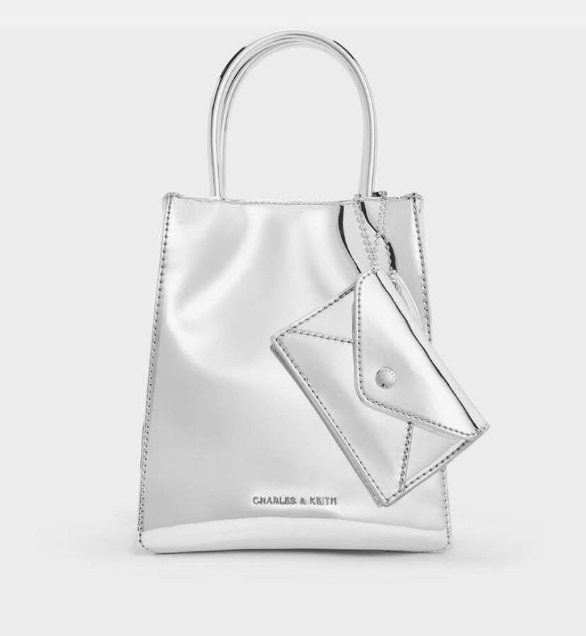 METALLIC CHARLES AND KEITH ORIG BAG (Category: Cross-body Bags) located in Cavite. Submitted by emispreloved (Listing ID 1349288448, Image 1). Description: MPO BAG LOC: KAWIT/CALOOCAN CAN SHIP NATIONWIDE MOP: GCASH OR CASH ON PICKUP.