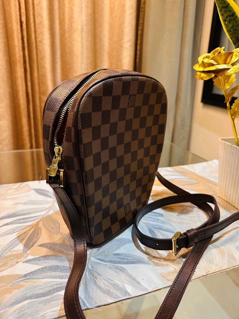 AUTHENTIC LV Damier body bag (Category: Luxury Bags & Wallets) located in Quezon City. Submitted by FashionFab (Listing ID 1349383038, Image 2). Description: 100% original in a very good condition. Rare pieces from LV Japan store. No damages. No foul smell. Original dust bag included..