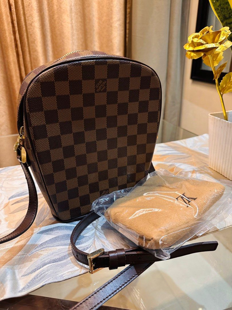 AUTHENTIC LV Damier body bag (Category: Luxury Bags & Wallets) located in Quezon City. Submitted by FashionFab (Listing ID 1349383038, Image 1). Description: 100% original in a very good condition. Rare pieces from LV Japan store. No damages. No foul smell. Original dust bag included..