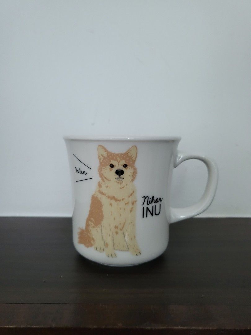 Ceramic Mug (Category: Coffee & Tea Tableware) located in Singapore. Submitted by yeeing (Listing ID 1349385367, Image 1). Description: Cute mug with dog print. Diameter of the top is abt 8cm. Height of the mug is also abt 8cm. Willing to give out for free if u buy any other items fr my list..