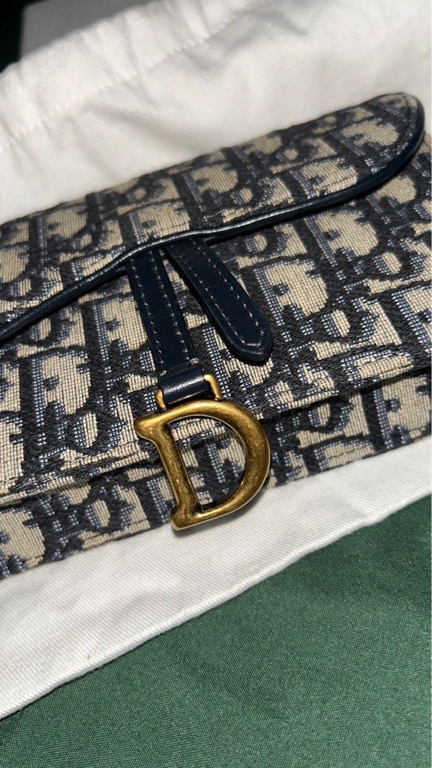 Dior Saddle Belt Pouch (Category: Luxury Bags & Wallets) located in Pateros City. Submitted by andi.dandi (Listing ID 1349454738, Image 3). Description: 💼 Condition: Gently used, in excellent condition with minimal signs of wear—it’s been well cared for, and still has plenty of life left to offer! 🌟 Features: Classic saddle design, adjustable belt strap, and iconic Dior logo for that unmistakable luxury vibe. 💵 Price: ₱50,000.00 This versatile