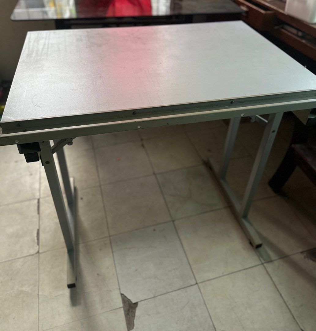 Drafting table ( metal ) for architectural courses (Category: Tables & Sets) located in Manila. Submitted by margajeru (Listing ID 1349227538, Image 1). Description: For sale : Drafting table metal type sya ( I can send video ) if you are interested issue : just need re paint if you want it to be look like brand new lng is 2ft lenght and 3ft width of the table location : Rizal area you can book via lalamove mejj mabigat ang table so I suggest nak