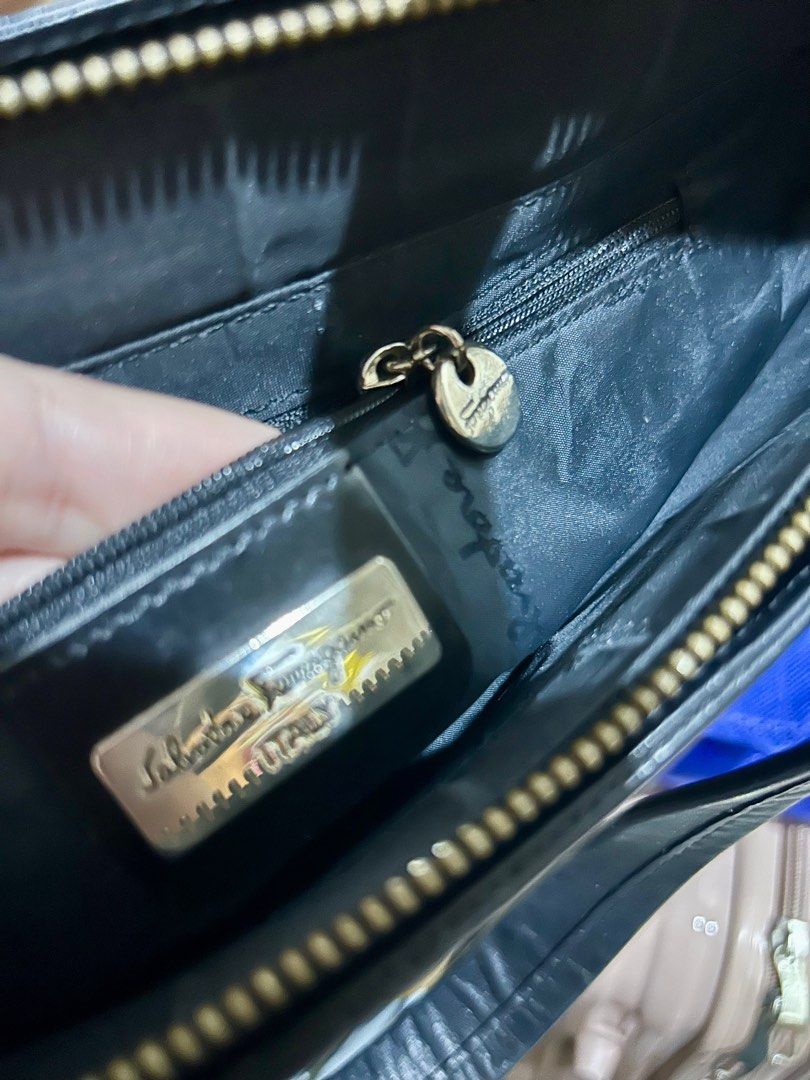 Ferragamo laptop/handbag (Category: Luxury Bags & Wallets) located in Quezon City. Submitted by asiaco (Listing ID 1349469339, Image 2). Description: Nagsusumigaw na ferragamo. Can be used as a laptop bag or just plain handbag. Replaced puller. .