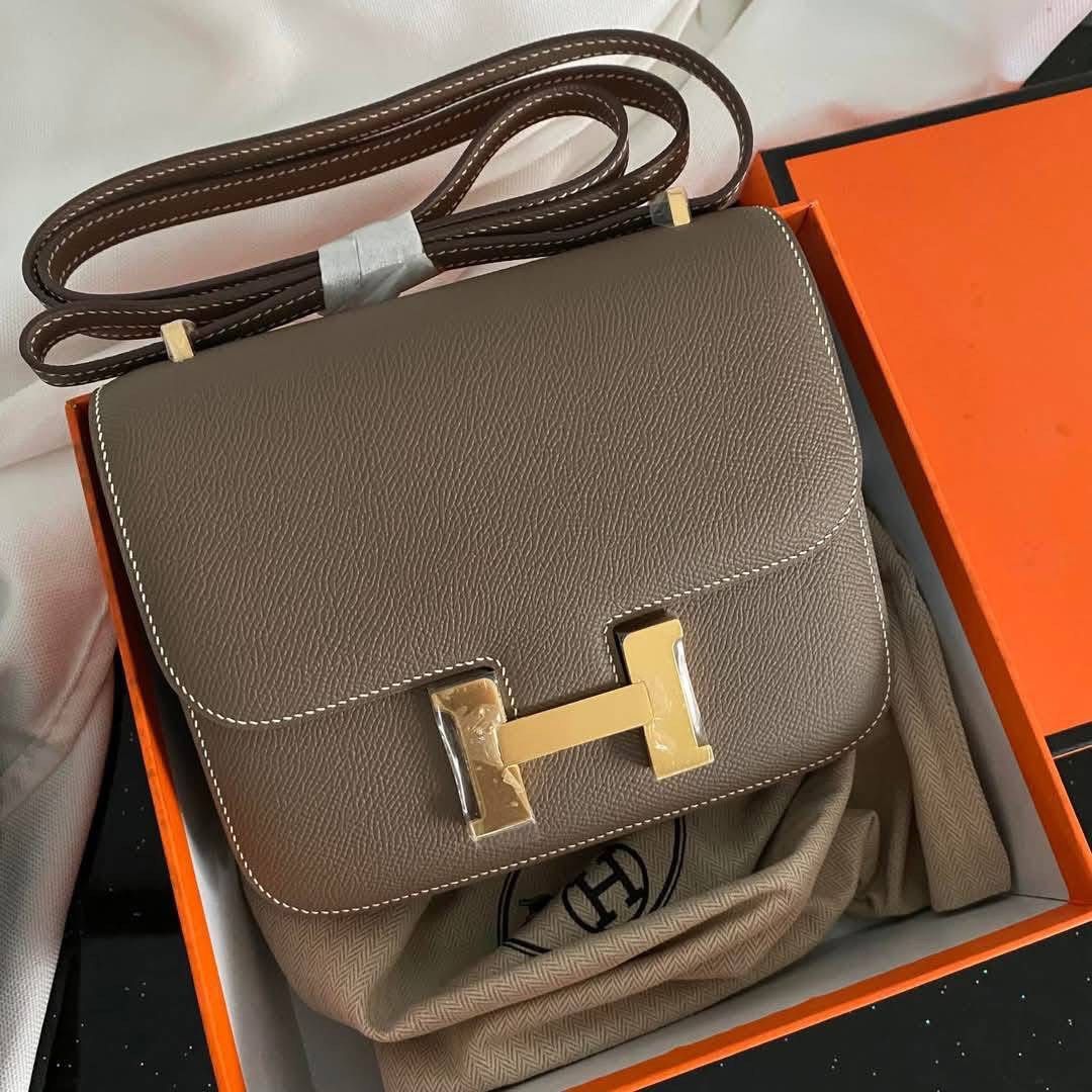 Hermes Constance Etoupe epsom leather (Category: Luxury Bags & Wallets) located in Quezon City. Submitted by rarebagsfrmjapan (Listing ID 1349367756, Image 1). Description: PERFECT GIFT OR GIVEAWAYS REWARD UR SELF OR LOVE ONES AT LEAST ONCE A YEAR !!! 𝐃𝐈𝐒𝐂𝐋𝐀𝐈𝐌𝐄𝐑: we are 𝐧𝐨𝐭 𝐚𝐬𝐬𝐨𝐜𝐢𝐚𝐭𝐞𝐝 𝐰𝐢𝐭𝐡 𝐭𝐡𝐞 𝐛𝐫𝐚𝐧𝐝𝐬 𝐭𝐡𝐚𝐭 𝐚𝐫𝐞 𝐥𝐢𝐧𝐤𝐞𝐝 𝐚𝐧𝐝 𝐬𝐭𝐚𝐭𝐞𝐝 𝐢𝐧 𝐭𝐡𝐢𝐬 𝐩𝐨𝐬𝐭. 𝐀𝐥𝐥 𝐫𝐢𝐠𝐡𝐭𝐬 𝐚𝐫𝐞 𝐫𝐞𝐬𝐞𝐫𝐯