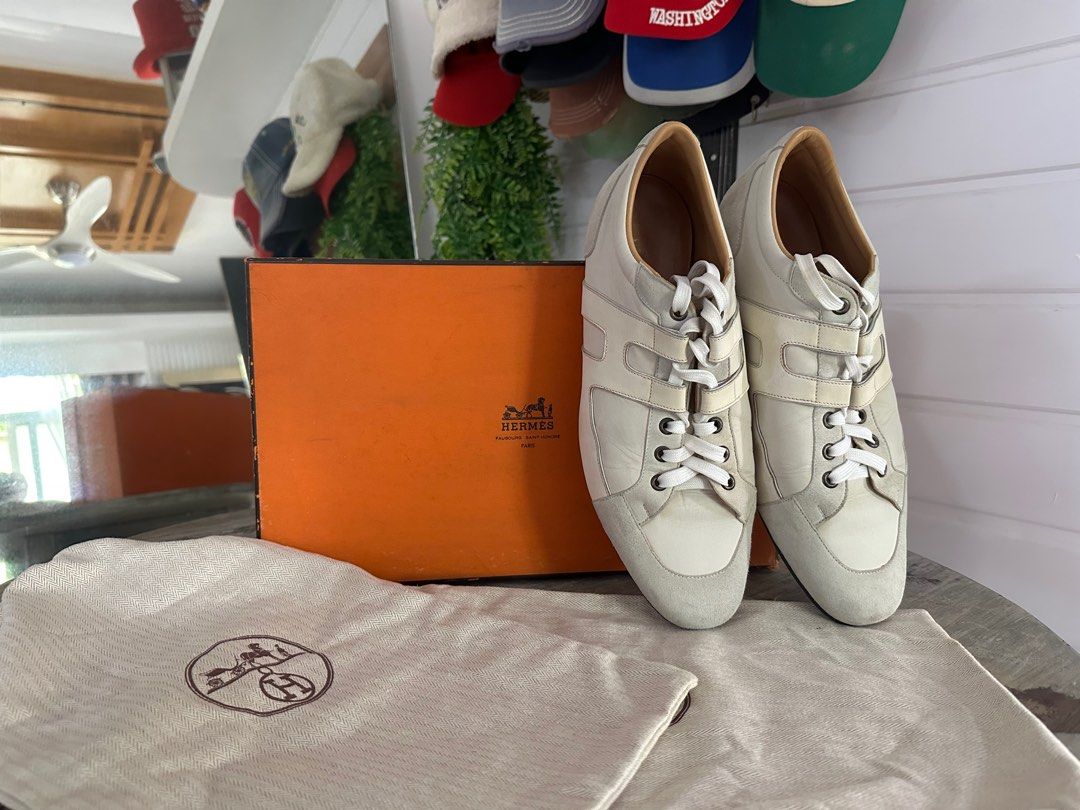 HERMES Men's Sneakers EU42/US8.5 (Category: Sneakers) located in Caloocan City. Submitted by samaldita (Listing ID 1349390414, Image 2). Description: - Classic low Hermes sneakers made of leather/suede in white/ecru with the typical Hermes "H" on the side - Size EU 42 / US 9 (MEN'S) - Original box and shoe bag included ‼️ - Used gently! Check sole photos for proof - A true collector's item!! Rare & discontinued by Hermes, hard to find - Bought in