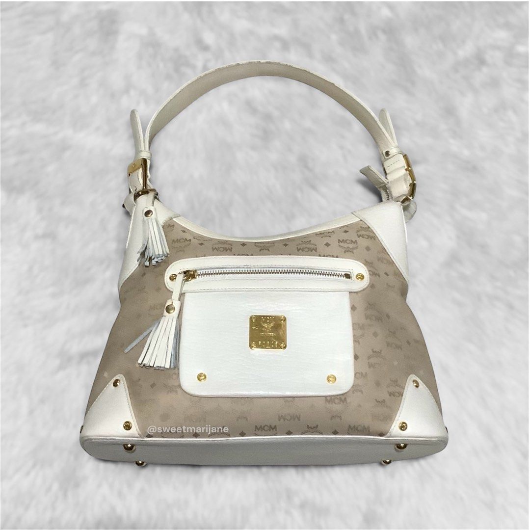 MCM Vintage Canvas-Leather Shoulder Bag (Category: Luxury Bags & Wallets) located in Bulacan. Submitted by sweetmarijane (Listing ID 1349360467, Image 1). Description: ~ Color: Cream/Ivory ~ Turnable screw, ykk zip, germany ~ Personal Collection ~ Rare finds ~ Looks new ~ Signs of usage ~ Minimal rubs on the handle/corners ~ Minimal fading/hairlines on the hardwares 💛Guaranteed Authentic 🧡Please no lowballing! 🤎All the details are in the photo
