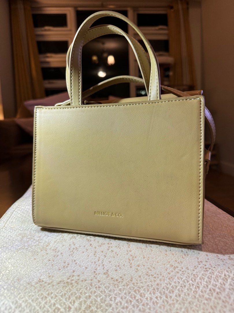 Milliot & Co Beige Sibilla Hand Bag (Category: Cross-body Bags) located in Makati City. Submitted by danandy12 (Listing ID 1349532469, Image 2). Description: Cute & petite Milliot & Co handbag! 💖 Beige. Comes with a strap to make it cross-body! Has 2 compartments in the front and through the zipper. Spent 1,200 on this last year, selling it low due to one minimal flaw (see last 2 pics). RFS: Too many bags.