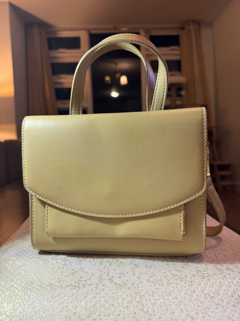 Milliot & Co Beige Sibilla Hand Bag (Category: Cross-body Bags) located in Makati City. Submitted by danandy12 (Listing ID 1349532469, Image 1). Description: Cute & petite Milliot & Co handbag! 💖 Beige. Comes with a strap to make it cross-body! Has 2 compartments in the front and through the zipper. Spent 1,200 on this last year, selling it low due to one minimal flaw (see last 2 pics). RFS: Too many bags.