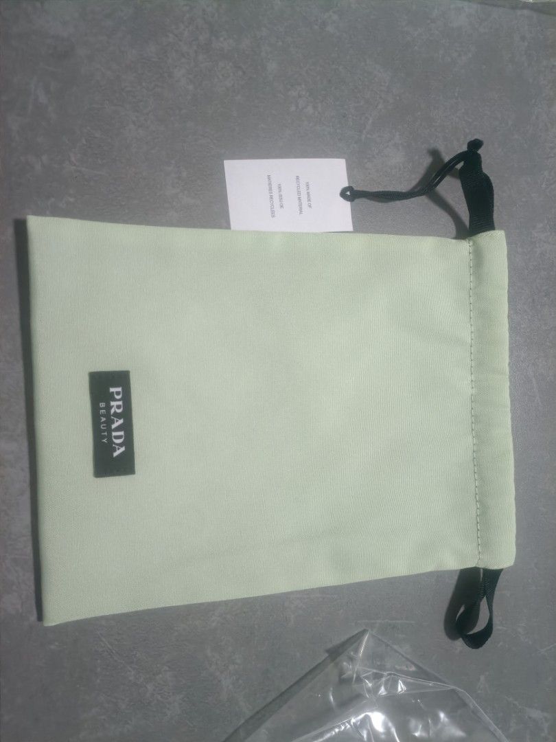 Prada drawstring pouch (Category: Bags & Wallets) located in Singapore. Submitted by kravelor (Listing ID 1349481192, Image 2). Description: Brand new Prada drawstring pouch. will also throw in another free pouch (no brand).
