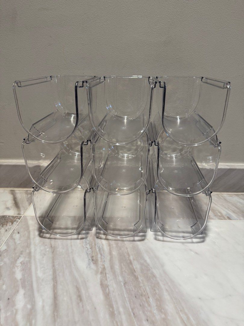 Stackable Bottle Organisers (Category: Storage Boxes & Baskets) located in Singapore. Submitted by sallii (Listing ID 1349385353, Image 1). Description: This clear, stackable bottle organizer (9 compartments) is crafted from high-quality transparent plastic, offering both durability and a sleek appearance. Its modular design allows you to easily customize the height and capacity to suit your needs. Each compartment features a semi-circular shape,