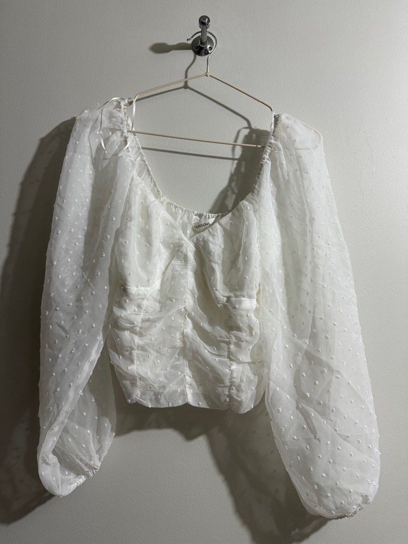 White Polka Bustier With Sheer Sleeves (Category: Blouses) located in Makati City. Submitted by danandy12 (Listing ID 1349538361, Image 1). Description: Bought in Australia. Cute and flattering! 🩷 Emphasizes cleavage without showing too much. Sophisticated and can still be formal if paired well with accessories. Size: S RFS: Doesn’t fit me anymore .