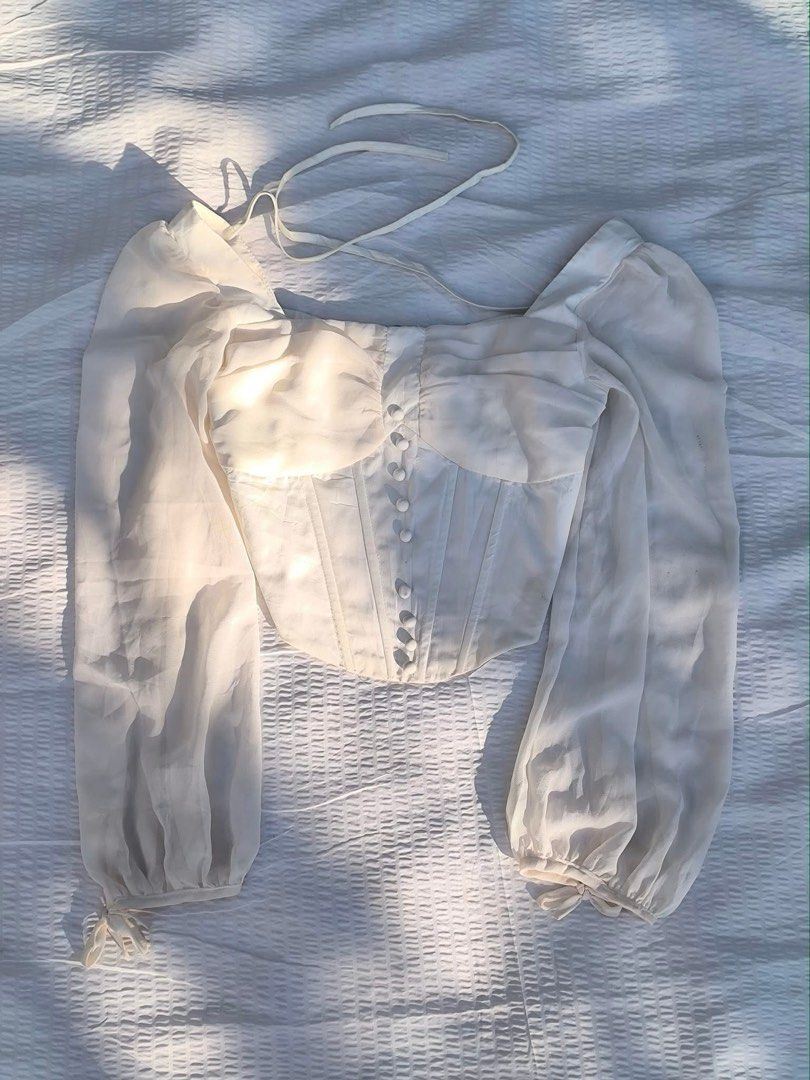 Dainty longsleeve Corset boning (Category: Others Tops) located in Manila. Submitted by BrandedCornerOutlet (Listing ID 1349643941, Image 3). Description: Size large. Actual when worn is already posted. Can worn pa offshie or as is. Bought this online for 1,500 selling it low cause the button on the middle is lost. With boning so it can define the shape of your body best fit talga to for large frame☺️ rfs: too large on me Ps. color may slightly v