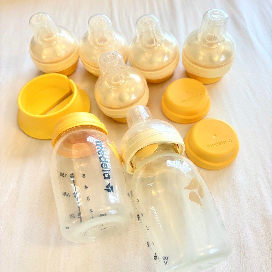 Medela Calma Teats and Bottles (Category: Breastfeeding & Bottle Feeding) located in Makati City. Submitted by meliii_ (Listing ID 1349653639, Image 2). Description: Take all: 2 bottles with 6 teats and stand - note that one of the teats has loose plastic cover but it doesn’t affect the teat itself.