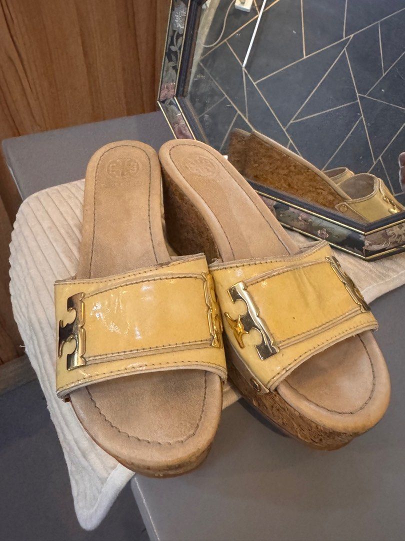 Tory Burch Pamela Tan gold wedge platform (Category: Wedges) located in Santa Maria. Submitted by tropique (Listing ID 1349585637, Image 1). Description: Signs of usage as seen in pics. But still in good condition. Well loved Size7 Have some flaws as seen in pics .