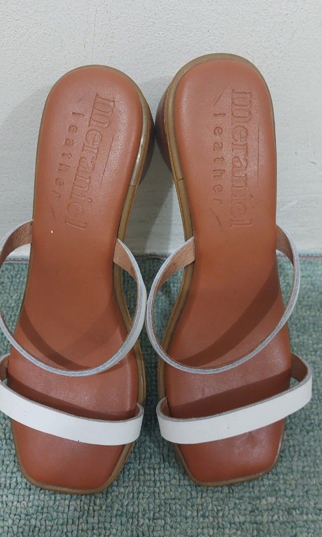 White slip on genuine leather sandal (Category: Flats & Sandals) located in Pasig City. Submitted by j.u.v.y (Listing ID 1349606091, Image 2). Description: size 5 heels - 1 inch RFS-decluttering locally crafted genuine leather.