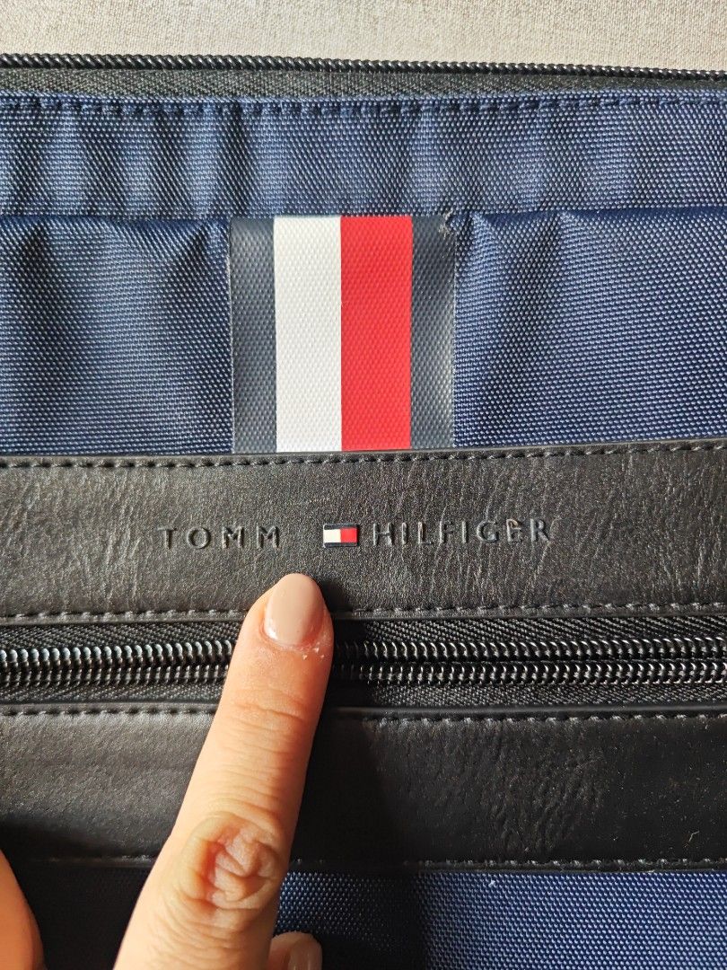 Authentic Tommy Hilfiger Laptop Messenger Bag (Category: Laptop Bags & Sleeves) located in Quezon City. Submitted by ohitsyel (Listing ID 1349765756, Image 2). Description: Authentic Tommy Hilfiger Laptop Messenger Bag fits 15" laptop lots of compartment inside selling for 1500 only ‼️‼️ reduced to 1.1k ‼️‼️ lightly used, but selling low because of the removed Y on front, E almost removed, and a small issue on top aside from that, no issues (see 