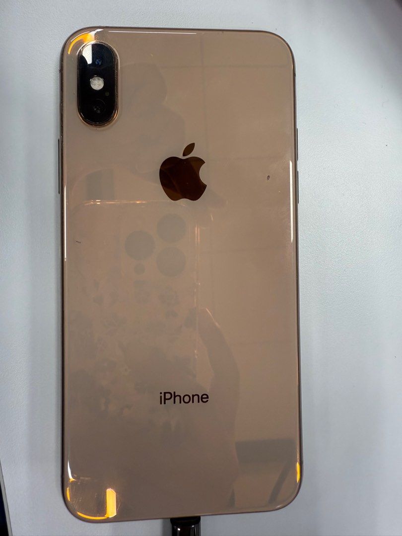 IPhone XS (Category: iPhone X Series) located in General Trias. Submitted by llayneaquino (Listing ID 1349795050, Image 1). Description: Iphone XS Gold 64Gb No Sim Restriction Working Face ID Working True Tone No camera issues 73 Battery Health Issues: No screen protector Replaced Backglass Scratches on side Ringer flip not working - can be turned on/off thru Assistive Touch Inclusions: Unit, case and box only Charger and earpods not included Sel