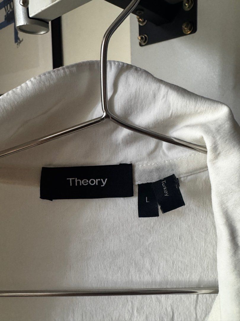 Theory White Zip Up Polo Shirt (Category: Tshirts & Polo Shirts ) located in Quezon City. Submitted by secondninico (Listing ID 1349866371, Image 2). Description: 20 x 25 in Original from Theory in Japan, has paneling as the front fabric is different from the back, nice blend of cotton and a breathable nylon Small yellow/brown stain in front that can be removed probably in the wash Measurements in Picture.