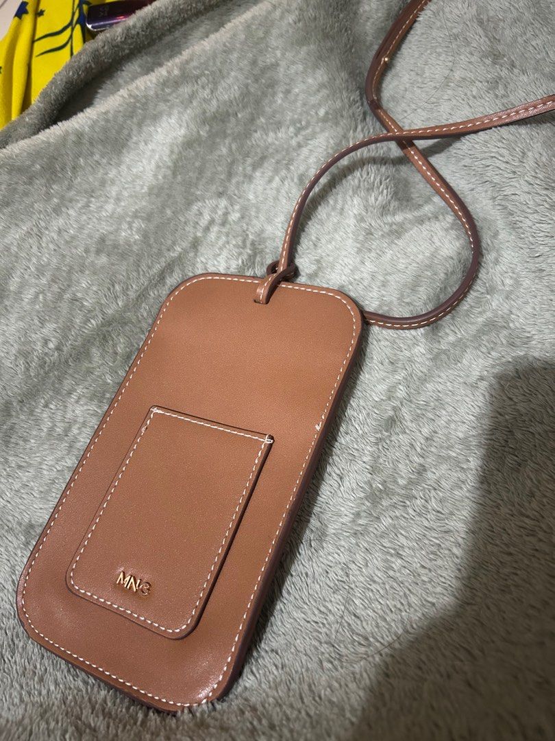 Auth MNG phone bag w/ cross body strap (Category: Cross-body Bags) located in Manila. Submitted by thriftmaaa (Listing ID 1350073420, Image 2). Description: Bought for arnd 1k Selling 400 Can fit pro max, there’s also a slot for cards.