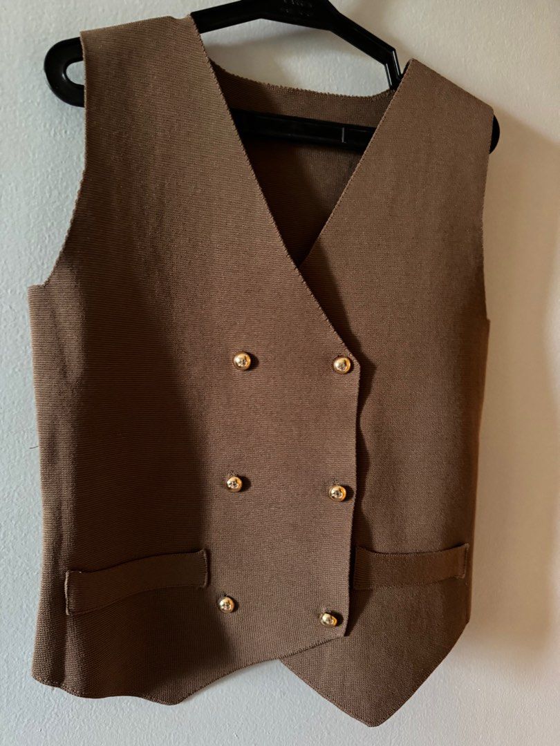 Brown knit vest (Category: Sleeveless) located in Consolacion. Submitted by thebundlequeen (Listing ID 1349949837, Image 2). Description: - fits S-M - thick knit material - bought in tiktok shop - available also in black (pls see listings) - Ships from Cebu..