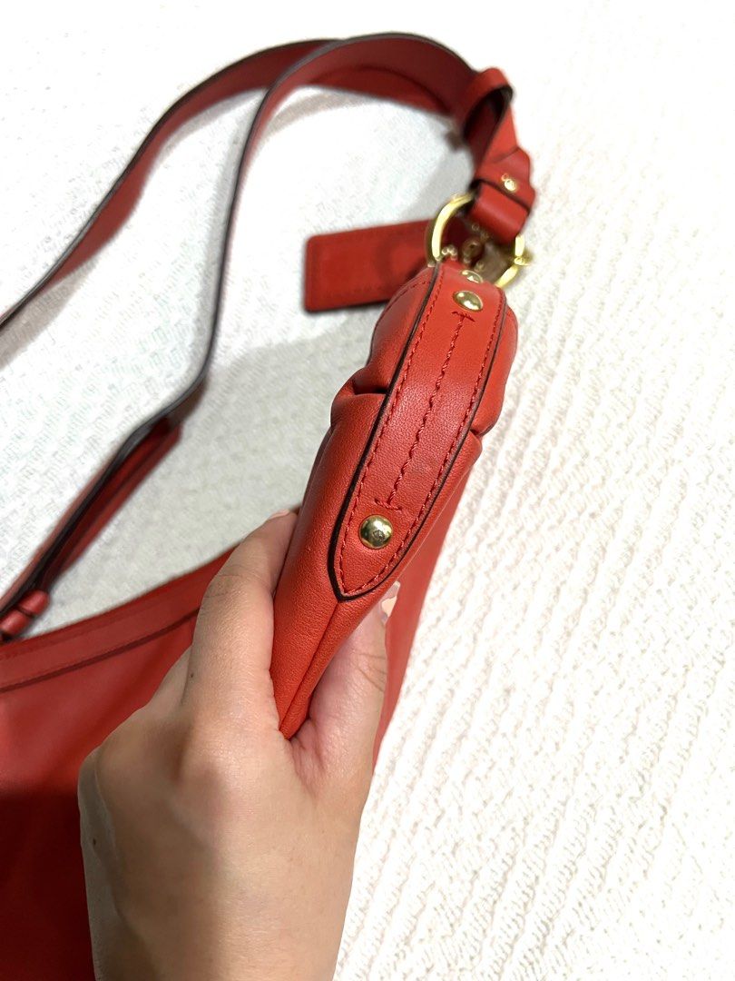 Vintage Coach Leather Bag with Adjustable Long Strap (Category: Luxury Bags & Wallets) located in Quezon City. Submitted by kuduu (Listing ID 1350026170, Image 3). Description: Beautiful red bag Clean interiors Super soft leather Clean corners, no signs of wear Only a little bit of discoloration on one of the rings from storage With care card No dustbag, but will send with proper packaging Meet up in Loyola Heights QC Delivery via lalamove, grab 