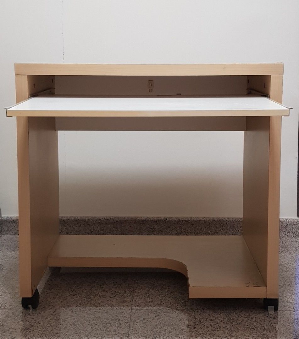 Computer table used (Category: Other Home Furniture) located in Singapore. Submitted by sk88sk (Listing ID 1349967890, Image 1). Description: computer table with wheels H75.5cm include wheels H70cm exclude wheels H65cm from floor to the pull out table L77cm W50cm top W 80cm include the pull out table Collection: my block at Sengkang.