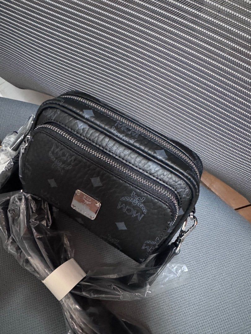 MCM unisex cross body bag (Category: Cross-body Bags) located in Malabon City. Submitted by ncdavadilla (Listing ID 1349999863, Image 2). Description: Bought from Duty Free. With dustbag. Brand new no issue.