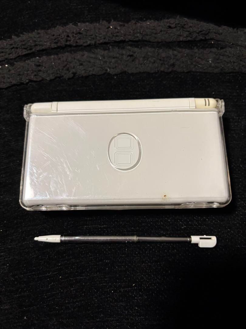 Nintendo DS Lite White with charger and case (Category: Nintendo) located in Manila. Submitted by japan_treasure (Listing ID 1350065766, Image 1). Description: White Nintendo DS Lite with stylus (non-genuine). Comes with charger and a worn out case. Operation confirmed. The main unit is in a clear case, and I don't know how to remove the clear case, so I am selling it as is. There is a film attached to the LCD. The touch pen is non-genuine and ex